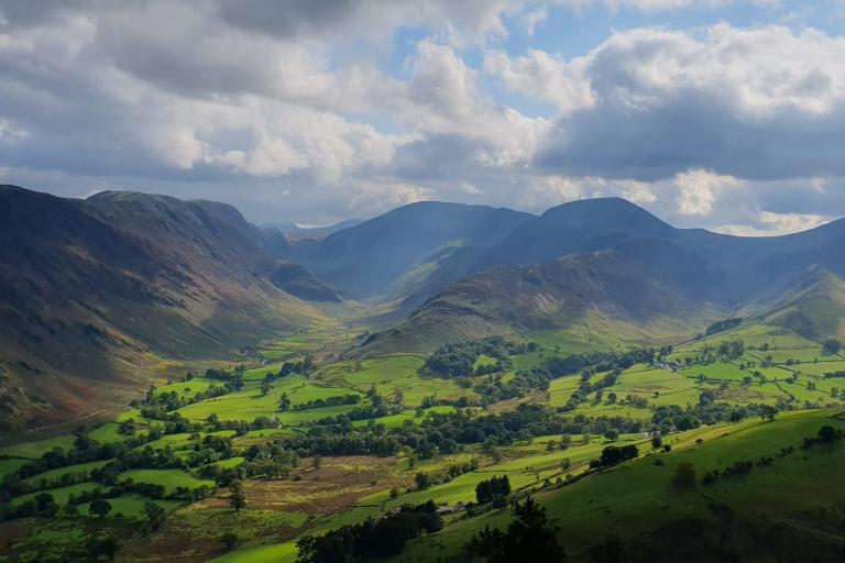 A view of the Newlands valley, with mountains in the background and fields in the foreground
